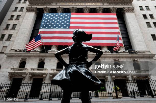 The New York Stock Exchange is pictured on April 20, 2020 at Wall Street in New York City. - Wall Street opened lower on Monday as traders grappled...
