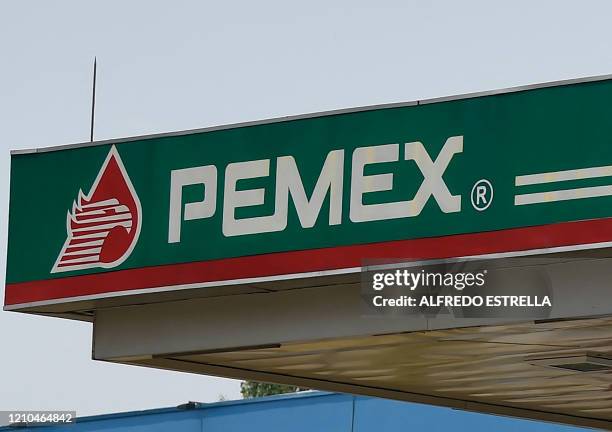Picture of the logo of Mexico's state oil company Pemex, taken at gas station in Mexico City on April 20, 2020 during the coronavirus COVID-19...