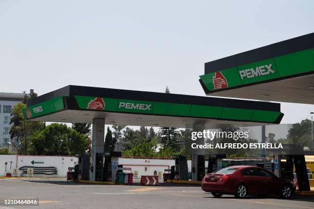 Picture taken at gas station of Mexico's state oil company Pemex, in Mexico City on April 20, 2020 during the coronavirus COVID-19 pandemic. Oil...