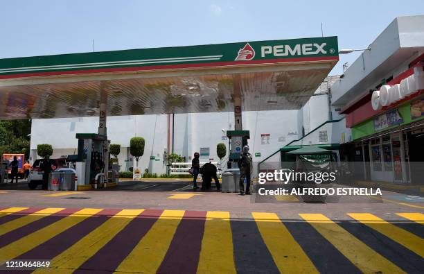 Picture taken at gas station of Mexico's state oil company Pemex, in Mexico City on April 20, 2020 during the coronavirus COVID-19 pandemic. Oil...