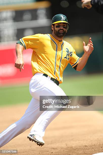 Conor Jackson of the Oakland Athletics runs the bases during the game against the Minnesota Twins at the Oakland-Alameda County Coliseum on July 31,...