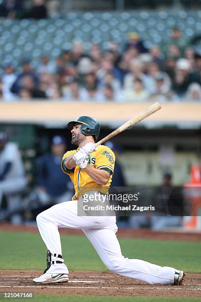 Conor Jackson of the Oakland Athletics bats against the Tampa Bay Rays at the Oakland-Alameda County Coliseum on July 25, 2011 in Oakland,...