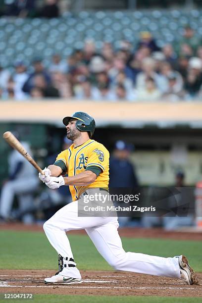 Conor Jackson of the Oakland Athletics bats against the Tampa Bay Rays at the Oakland-Alameda County Coliseum on July 25, 2011 in Oakland,...