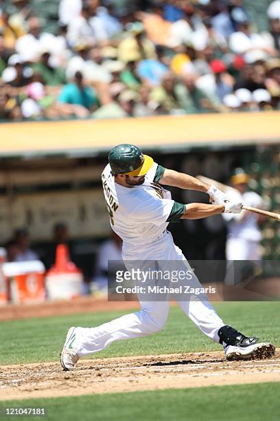 Conor Jackson of the Oakland Athletics bats against the Tampa Bay Rays at the Oakland-Alameda County Coliseum on July 28, 2011 in Oakland,...