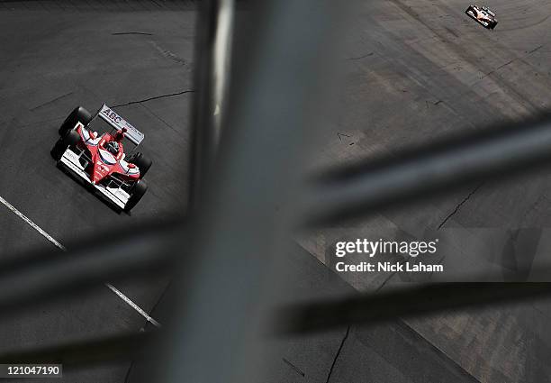 Vitor Meira of Brazil, drives the A.J. Foyt Enterprises Dallara Honda during practice for the IZOD IndyCar Series MoveThatBlock.com Indy 225 at New...