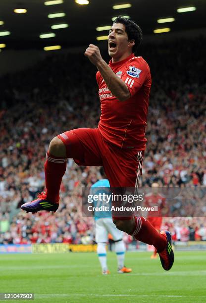 Luis Suarez of Liverpool celebrates after scoring the opening goal during the Barclays Premier League match between Liverpool and Sunderland at...