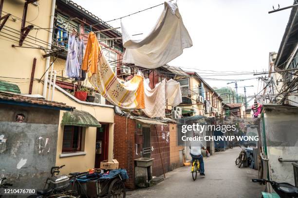 street in the old town of shanghai, china - china slums stock pictures, royalty-free photos & images
