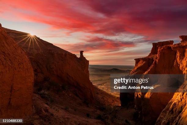 mongolia, gobi desert, bayanzag valley, flaming cliffs at sunset. - independent mongolia stock pictures, royalty-free photos & images