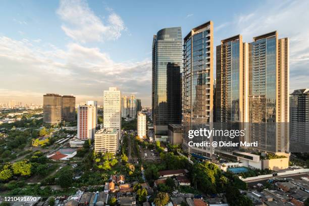 modern office and condominium towers in jakarta downtown district in indonesia capital city - newly industrialized country imagens e fotografias de stock