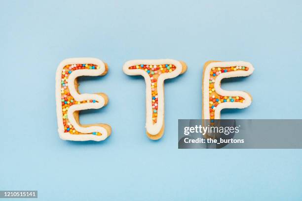 high angle view of etf letters on blue background, symbol of investment in stocks - cookie exchange stock pictures, royalty-free photos & images