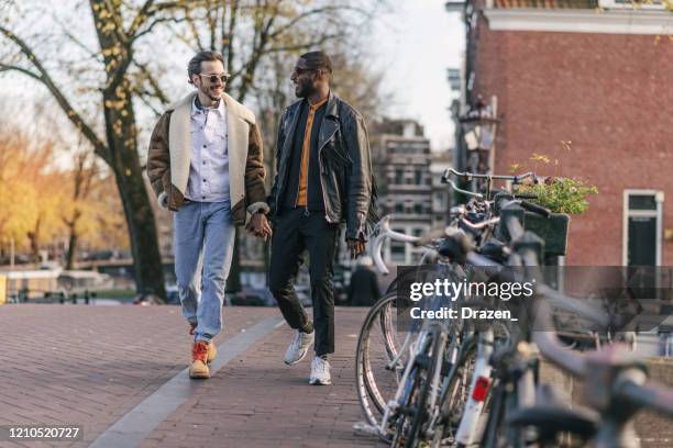 millennial gay couple on city break - daily life in amsterdam imagens e fotografias de stock