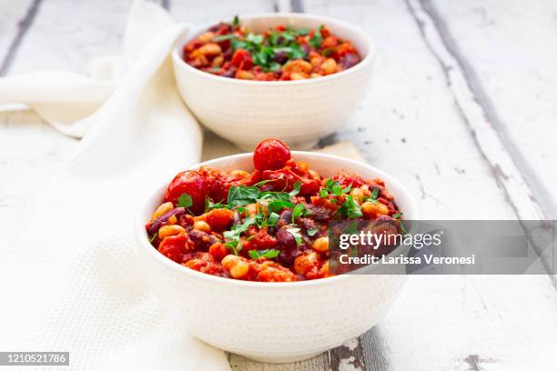 two bowls of vegan baked beans - stew stock pictures, royalty-free photos & images