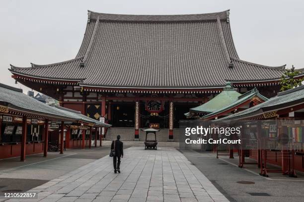 Man walks towards Sensoji Temple, one of Tokyos most popular tourist sites, on April 21, 2020 in Tokyo, Japan. Foreign visitor numbers to Japan have...