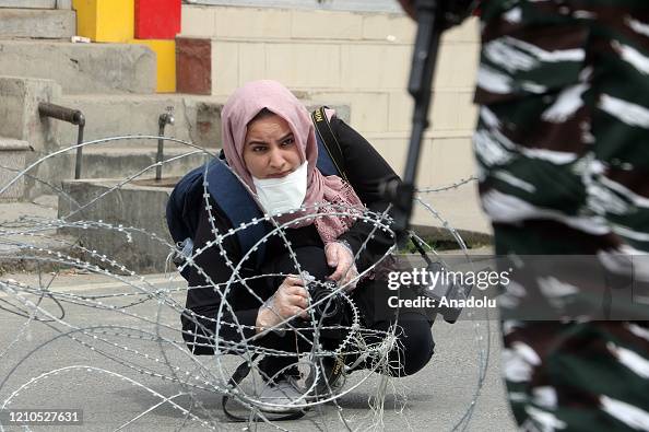 Masrat Rasool Photojournalist Masrat Zahra takes photos near a temporary checkpoint ...