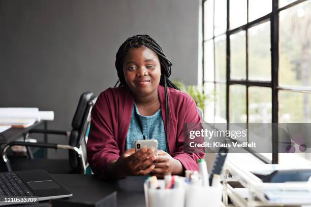 entrepreneur using mobile phone at workplace - blind woman stock pictures, royalty-free photos & images