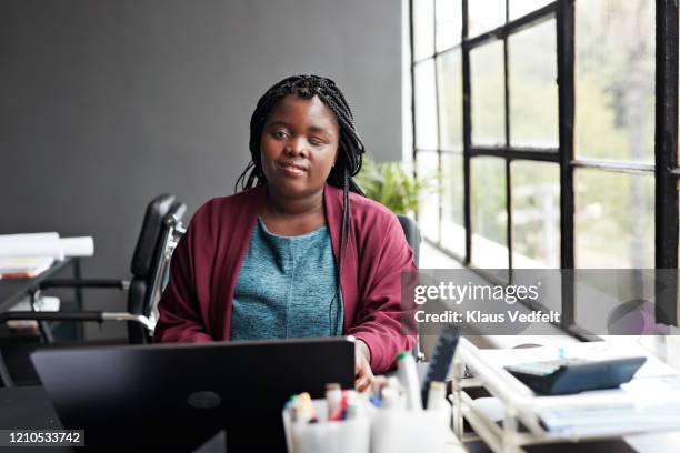 businesswoman using laptop at modern workplace - accessibility blind stock pictures, royalty-free photos & images