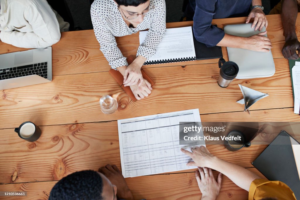 Business people discussing at table in office