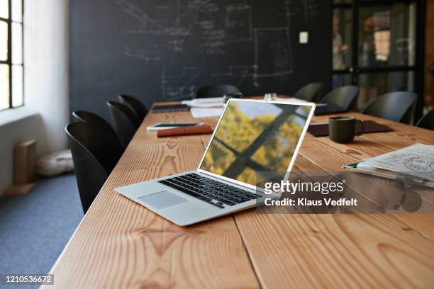 reflection of window on laptop at conference table - laptop stock pictures, royalty-free photos & images