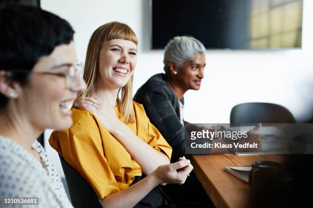 entrepreneur with coworker in office meeting - employee engagement stock pictures, royalty-free photos & images