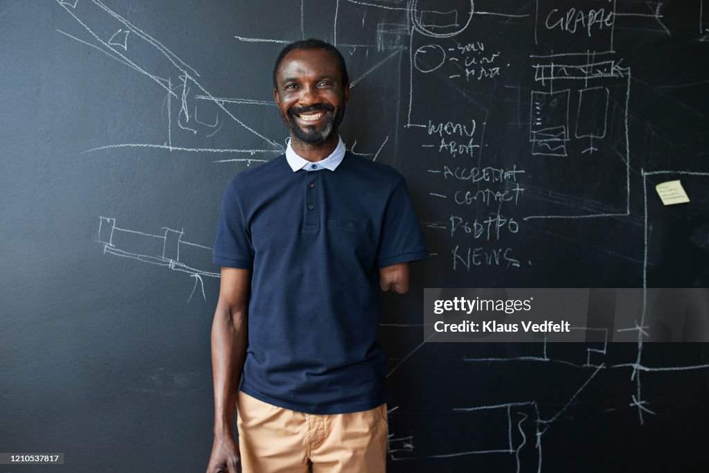 Portrait of amputated businessman in office