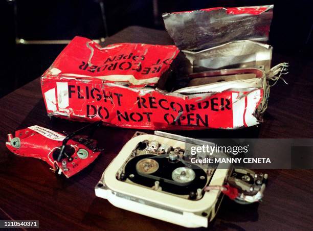 The flight data recorder from Alaska Airlines Flight 261 sits on a table in front of National Transportation Safety Board Chairman Jim Hall during a...