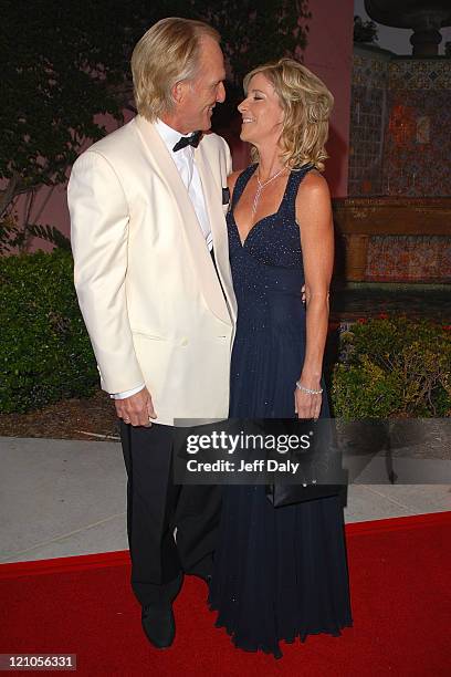 Golfer Greg Norman and Tennis Pro Chris Evert attend the Chris Evert/Raymond James Pro Celebrity tennis classic cocktail reception and silent auction...