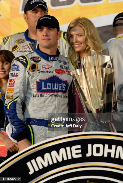 Nascar Champion Jimmie Johnson and his wife Chandra celebrate Johnson winning his second consecutive Nextel Cup championship at the Homestead Miami...