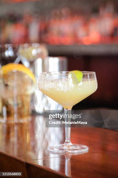 cocktails on bar counter - cocktail counter stock pictures, royalty-free photos & images