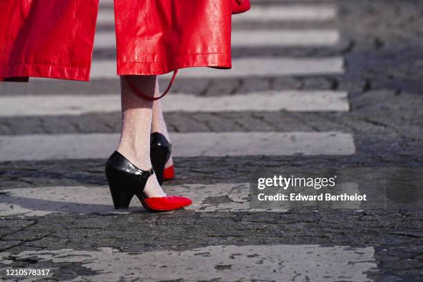 Guest wears black and white leather Chanel pointy shoes, outside Chanel, during Paris Fashion Week - Womenswear Fall/Winter 2020/2021 on March 03,...