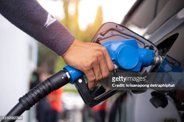 oil pump,refueling at gas station - plug and play store stock pictures, royalty-free photos & images