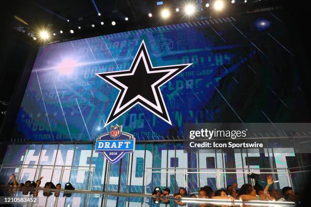 The Dallas Cowboys logo on the video board during the first round at the 2018 NFL Draft at AT&T Statium on April 26, 2018 at AT&T Stadium in...