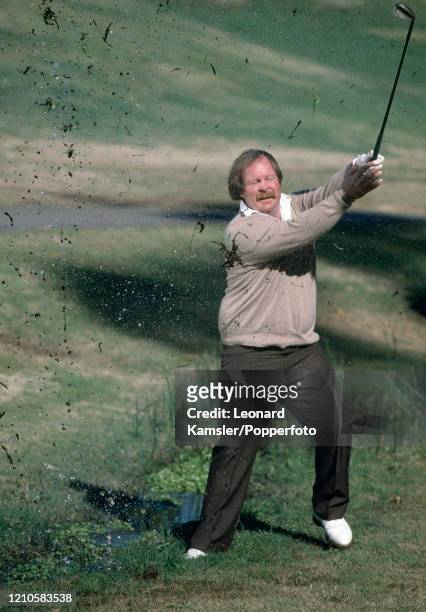 American golfer Craig Stadler playing out of a wet lie, circa 1990.