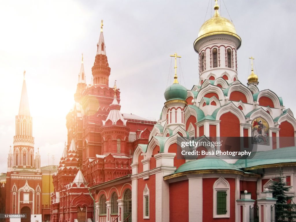 View of spectacular landmarks in Moscow's Red Square, including the Nikolskaya Tower, the State Historical Museum and the Kazan Cathedral. Moscow, Russia