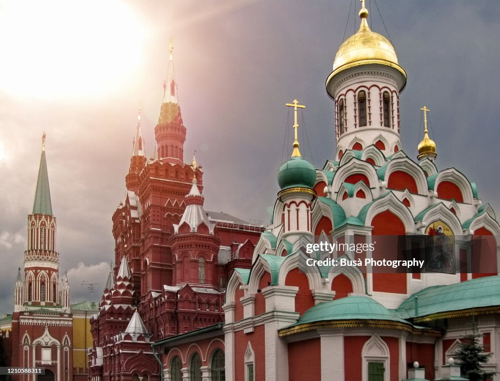 View of spectacular landmarks in Moscow's Red Square, including the Nikolskaya Tower, the State Historical Museum and the Kazan Cathedral. Moscow, Russia