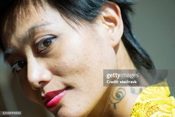 closeup portrait of woman with neck tattoo - showus skin stock pictures, royalty-free photos & images