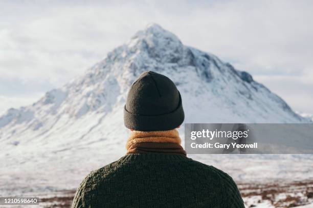 male hiker in winter mountain landscape - mountain peak stock pictures, royalty-free photos & images