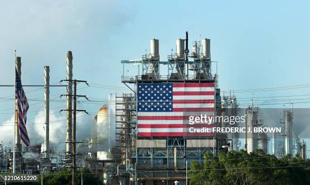 The US flag is displayed at the Wilmington Oil Fields south of Los Angeles, California on April 21 a day after oil prices dropped to below zero as...