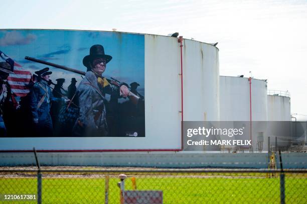 Mural with figures from Texas Revolution is featured on the side of an oil storage facility tank at the Vopak Terminal Deer Park on April 21, 2020 in...