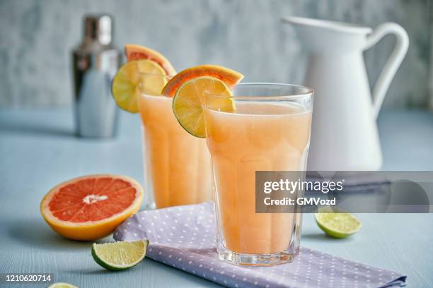 grapefruit lime summer drink cocktail - grapefruit cocktail stock pictures, royalty-free photos & images