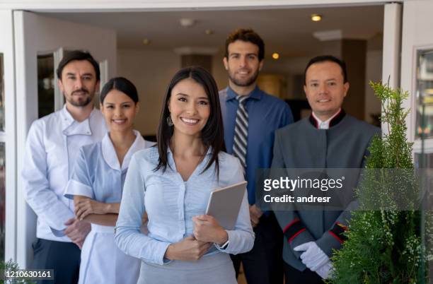 group of workers at a hotel - hotel stock pictures, royalty-free photos & images