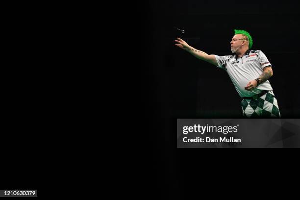 Peter Wright of Scotland throws during his match against Nathan Aspinall of England during Night Five of the Premier League Darts at Westpoint on...