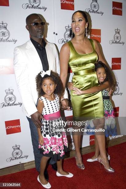 Djimon Hounsou, Kimora Lee Simmons, Aoki Lee Simmons and Ming Lee Simmons attend the launch of Kimora Lee Simmons' new clothing line Fabulosity for...