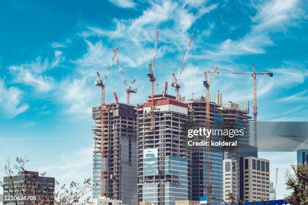 construction site against blue sky - commercial real estate as investment increases stock pictures, royalty-free photos & images