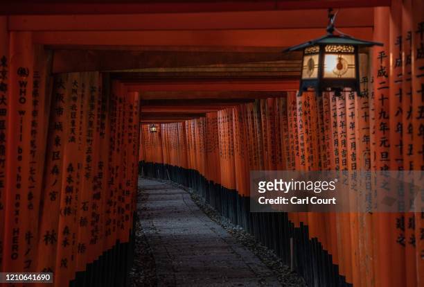 The torii path at Fushimi Inari-taisha shrine, one of Japan's most popular tourist destinations, is pictured empty on April 22, 2020 in Kyoto, Japan....