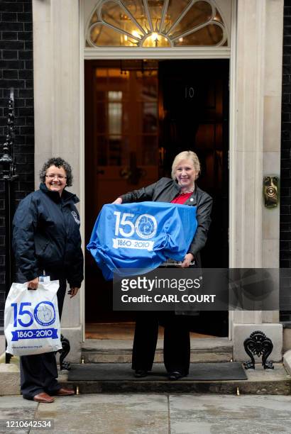 Of Battersea Dogs and Cats home Claire Horton carries 'Larry,' a cat, in a covered cage to 10 Downing Street in London on February 15, 2011 on his...
