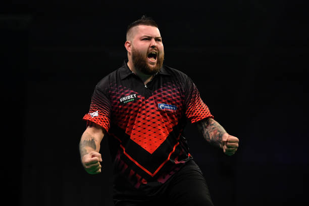 Michael Smith of England celebrates victory during his match against Michael van Gerwen of the Netherlands during Night Five of the Premier League...