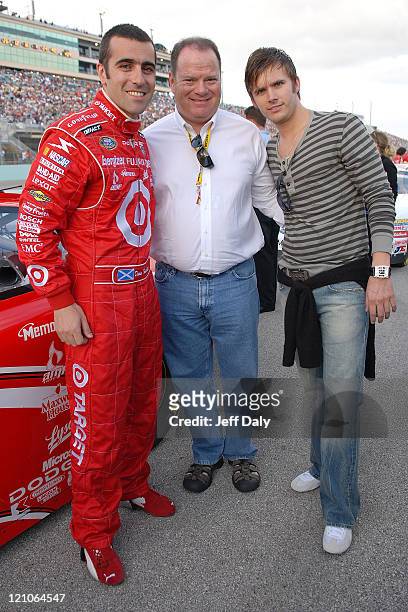Driver and husband of actress Ashley Judd, Dario Franchitti , team owner Chip Ganassi and Indy Racing League Champion Dan Wheldon attend practice at...
