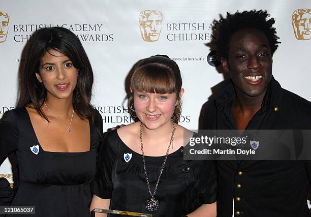 Konnie Huq, Rosalind Peters winner of CBBC Me And My Movie, The unwelcome Stranger, and Andy Akinwolere pose for pictures in the Press Room of 12th...