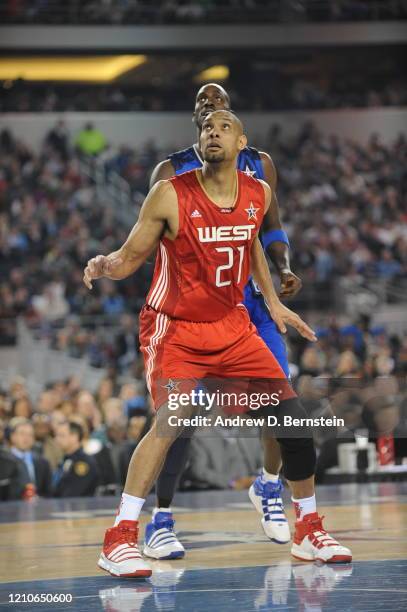 Tim Duncan of the Western Conference plays defense against Kevin Garnett of the Eastern Conference during the NBA All-Star Game, part of 2010 NBA...