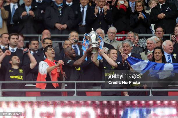 Wigan Players lift the FA Cup and celebrate after Wigan's victory in The FA Cup With Budweiser Final match between Manchester City &amp; Wigan...